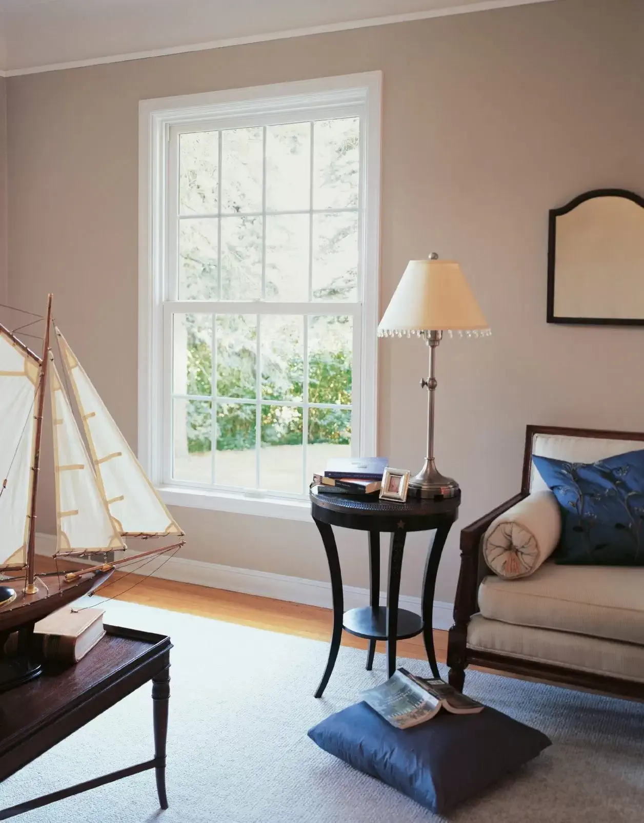 Living room with large window and neutral decor